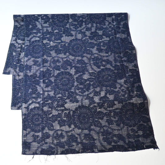 Vintage Japanese tsumugi kimono silk fabric piece with a classic chrysanthemum arabesque pattern.