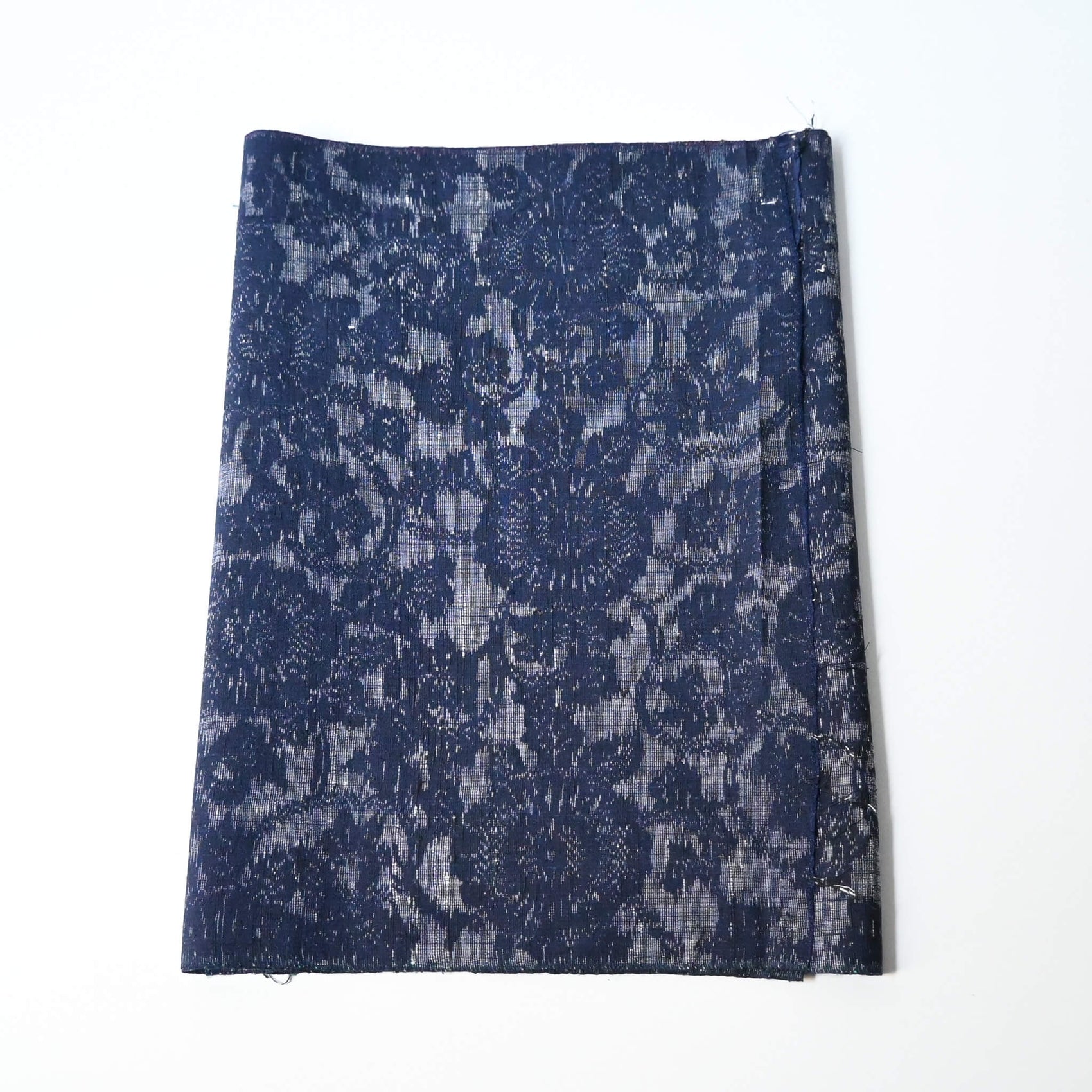 Vintage Japanese tsumugi kimono silk fabric piece with a classic chrysanthemum arabesque pattern.