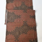 Full view of vintage brown tusmugi kimono silk fabric piece with chrysanthemum motif.