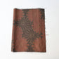 Vintage brown tusmugi kimono silk fabric piece with chrysanthemum motif.