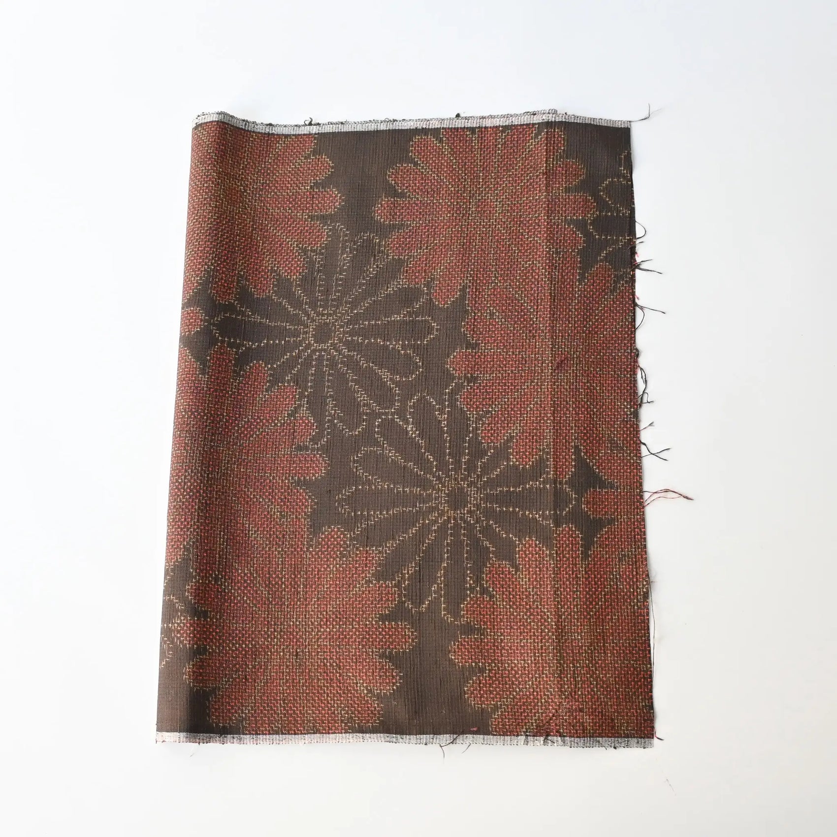 Vintage brown tusmugi kimono silk fabric piece with chrysanthemum motif.