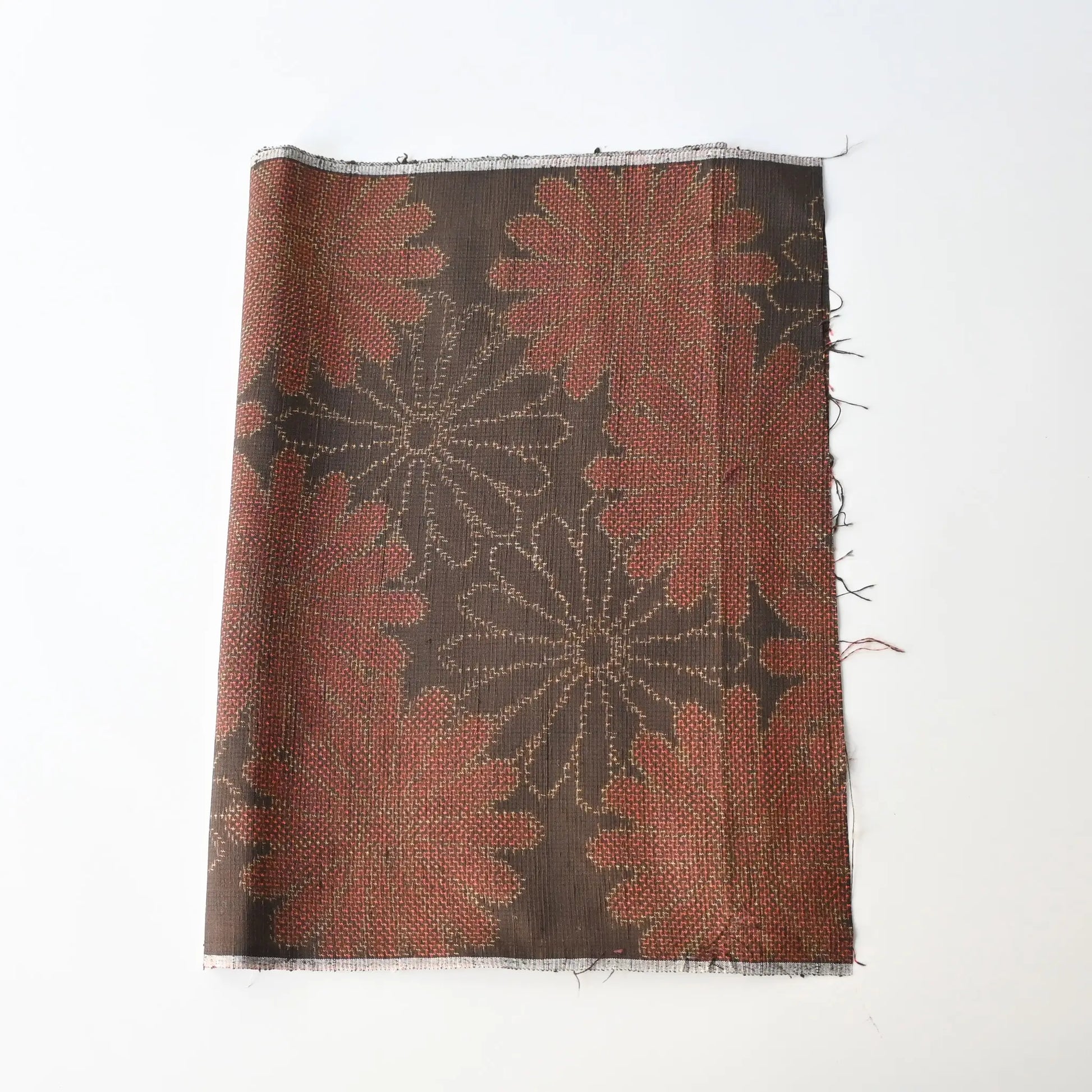 Vintage brown tusmugi kimono silk fabric piece with chrysanthemum motif.