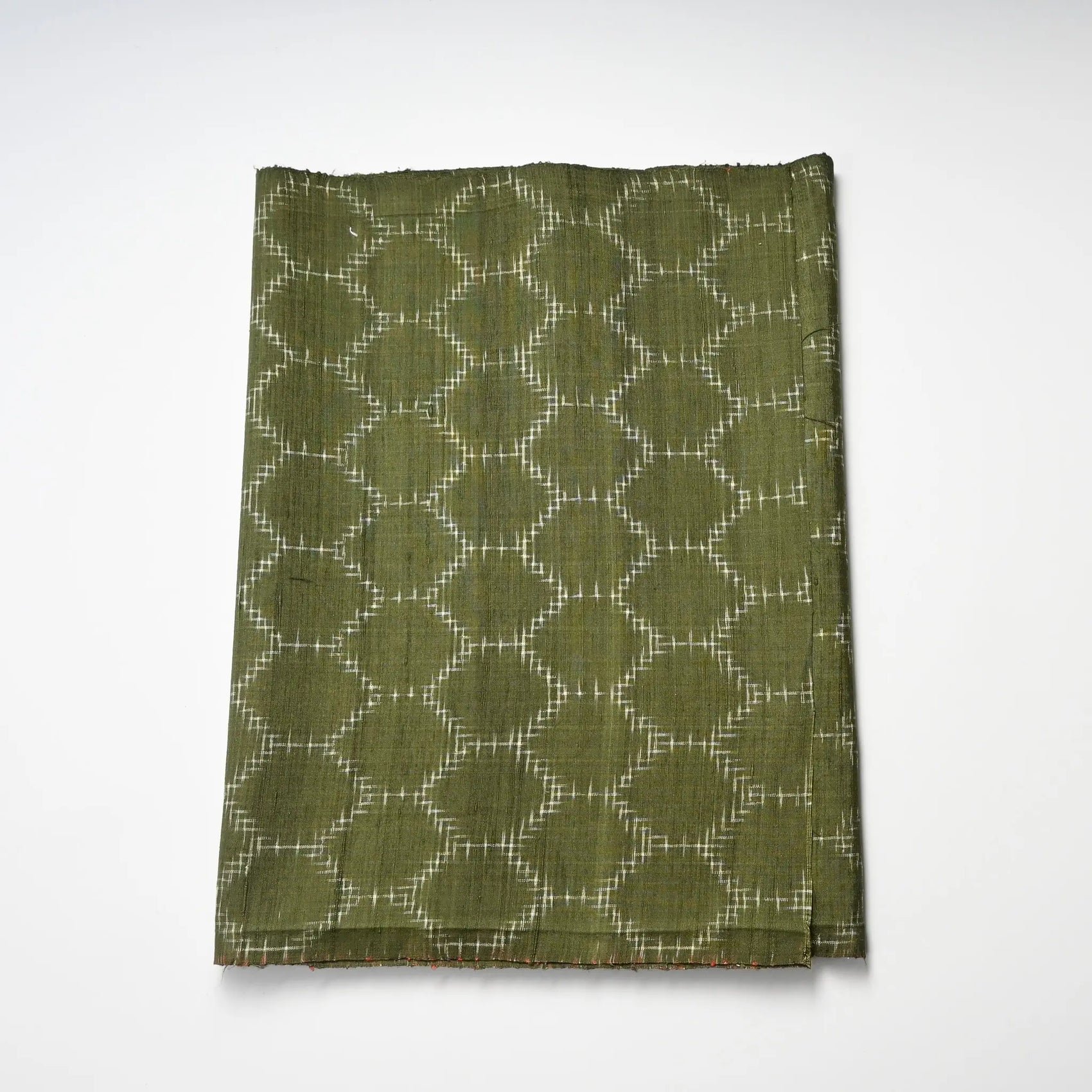 Vintage Japanese tsumugi silk kimono fabric in beautiful moss green with tortoise shell motif.