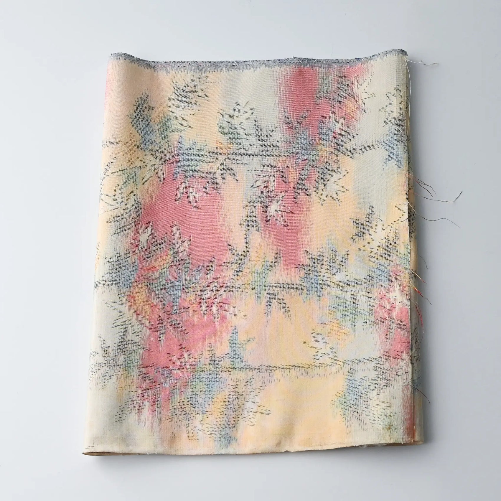 Vintage tsumugi silk kimono fabric piece in soft yellow and pink with bamboo motif.