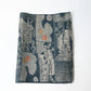 Vintage muted blue tsumugi silk kimono fabric piece with houses and chrysanthemum accents.
