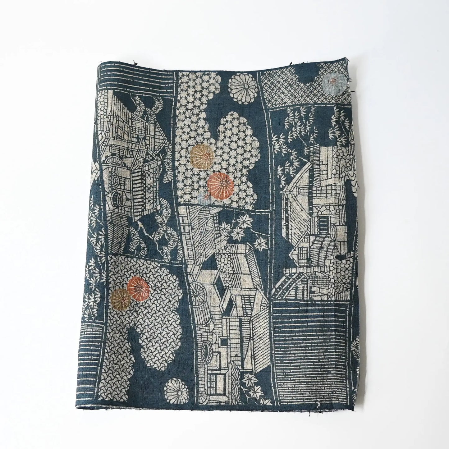 Vintage muted blue tsumugi silk kimono fabric piece with houses and chrysanthemum accents.