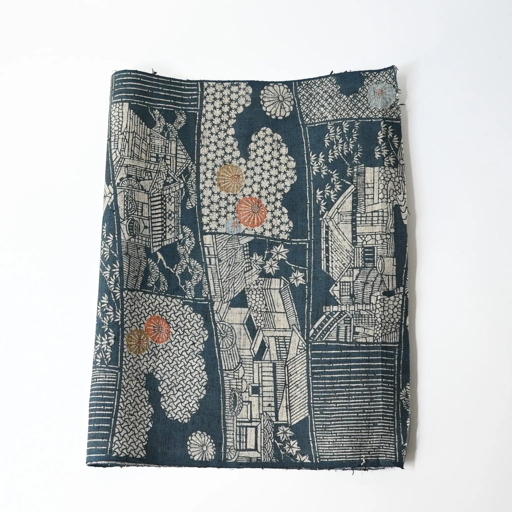 Vintage muted blue tsumugi silk kimono fabric piece with houses and chrysanthemum accents.