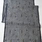 Full view of vintage tsumugi silk kimono fabric with intricate woven geometric pattern.