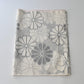 Vintage Japanese tsumugi silk kimono fabric with large round chrysanthemum pattern  in grey.