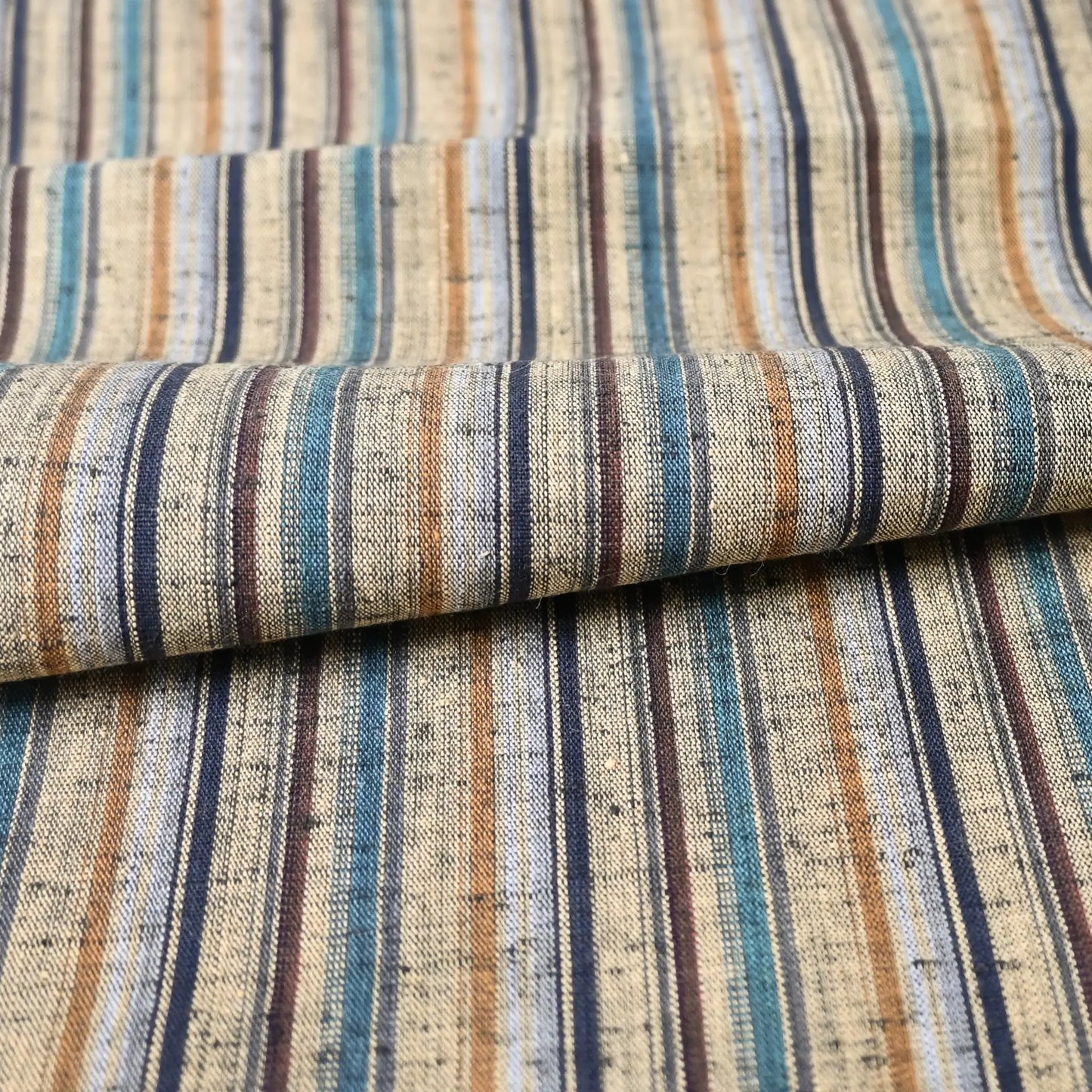 Detailed view of vintage tsumugi cotton bolt, stripe in natural tone, for women's casual kimono.