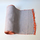 Vintage silk shibori kimono fabric dyed with a misty blue-grey base and soft orange accents.
