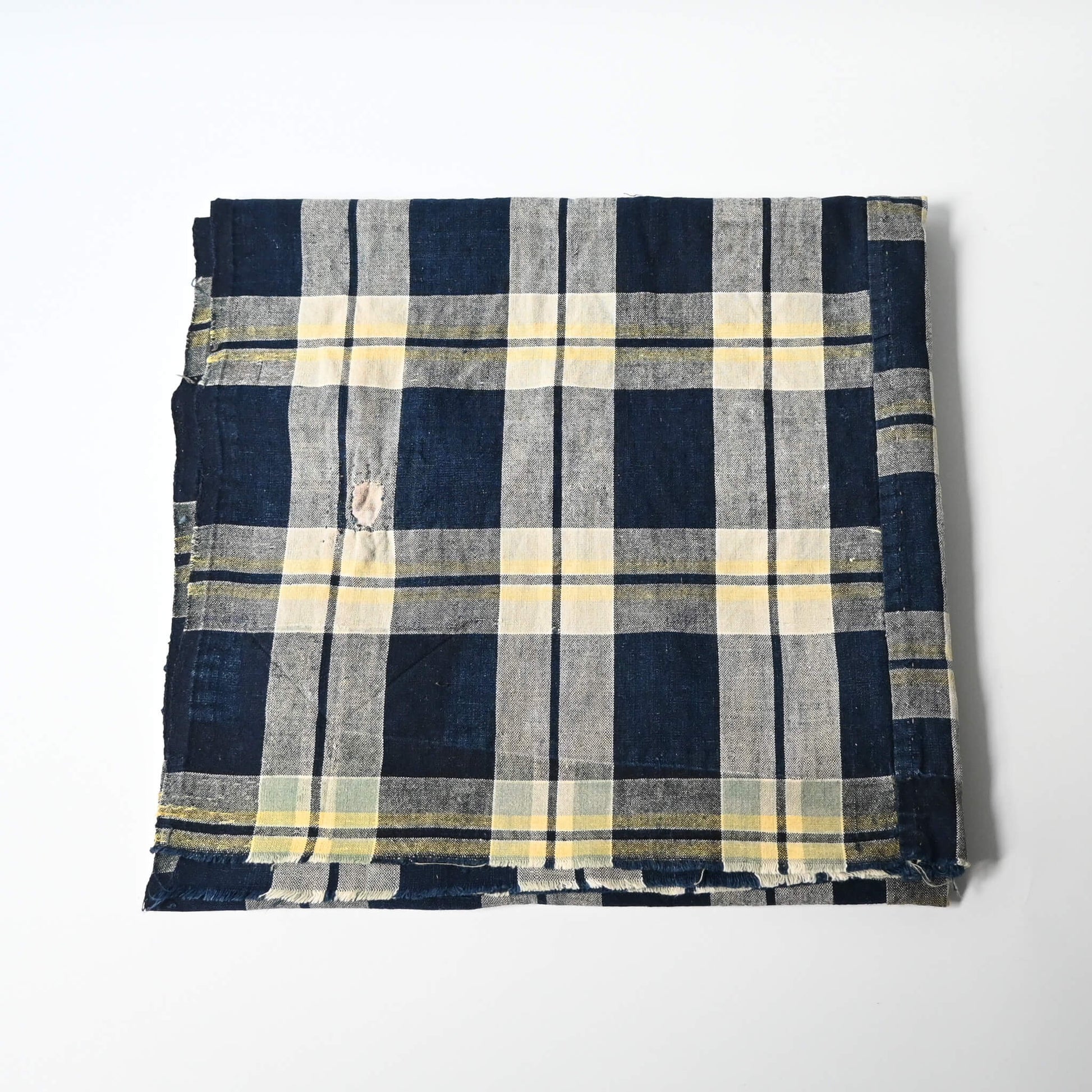Vintage Japanese two-panel indigo check cotton futon cover with a little patch.