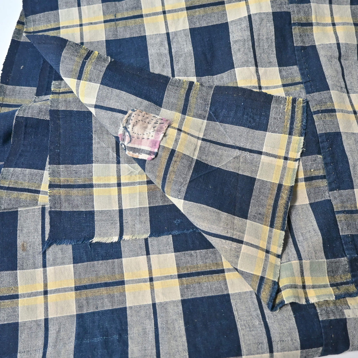 Vintage Japanese two-panel indigo check cotton futon cover with a little patch.