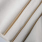 Close-up view of vintage Japanese undyed plain silk kimono fabric in cream, ivory tone.