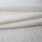 Close-up view of vintage undyed textured stripe silk kimono fabric sold by the metre.