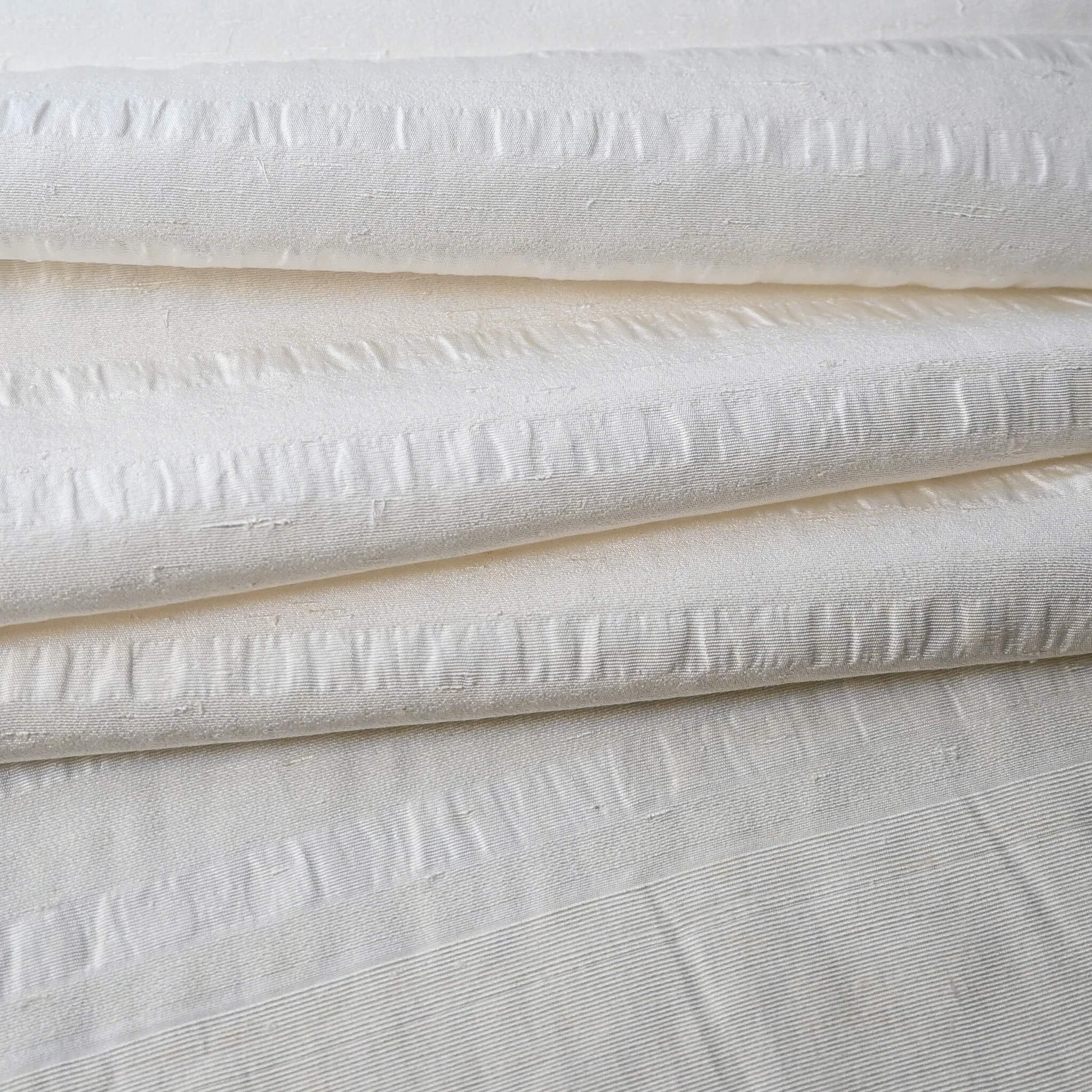 Close-up view of vintage undyed textured stripe silk kimono fabric sold by the metre.