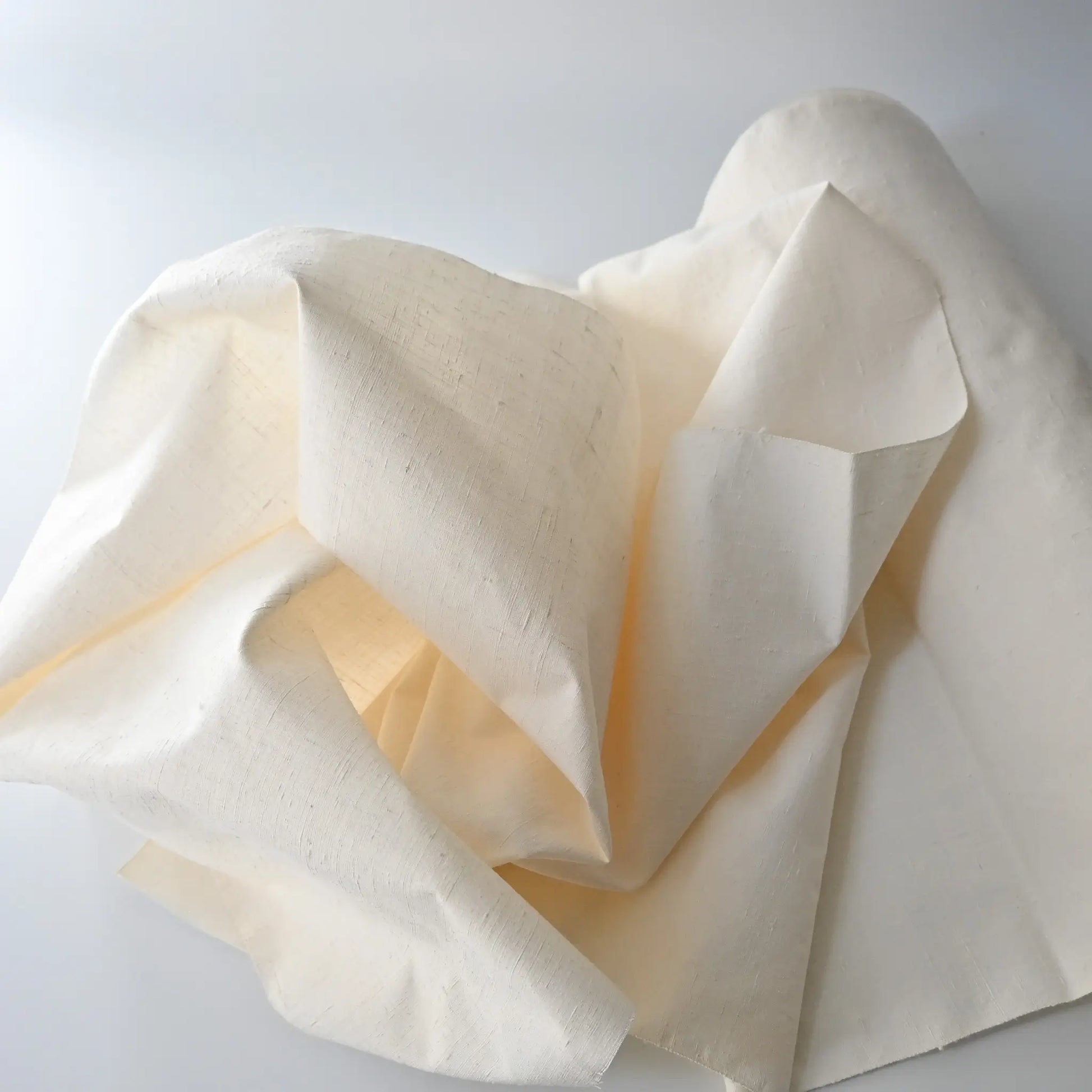 Vintage undyed yuki-tsumugi silk with textured slobs, crisp hand, ideal for dyeing projects.