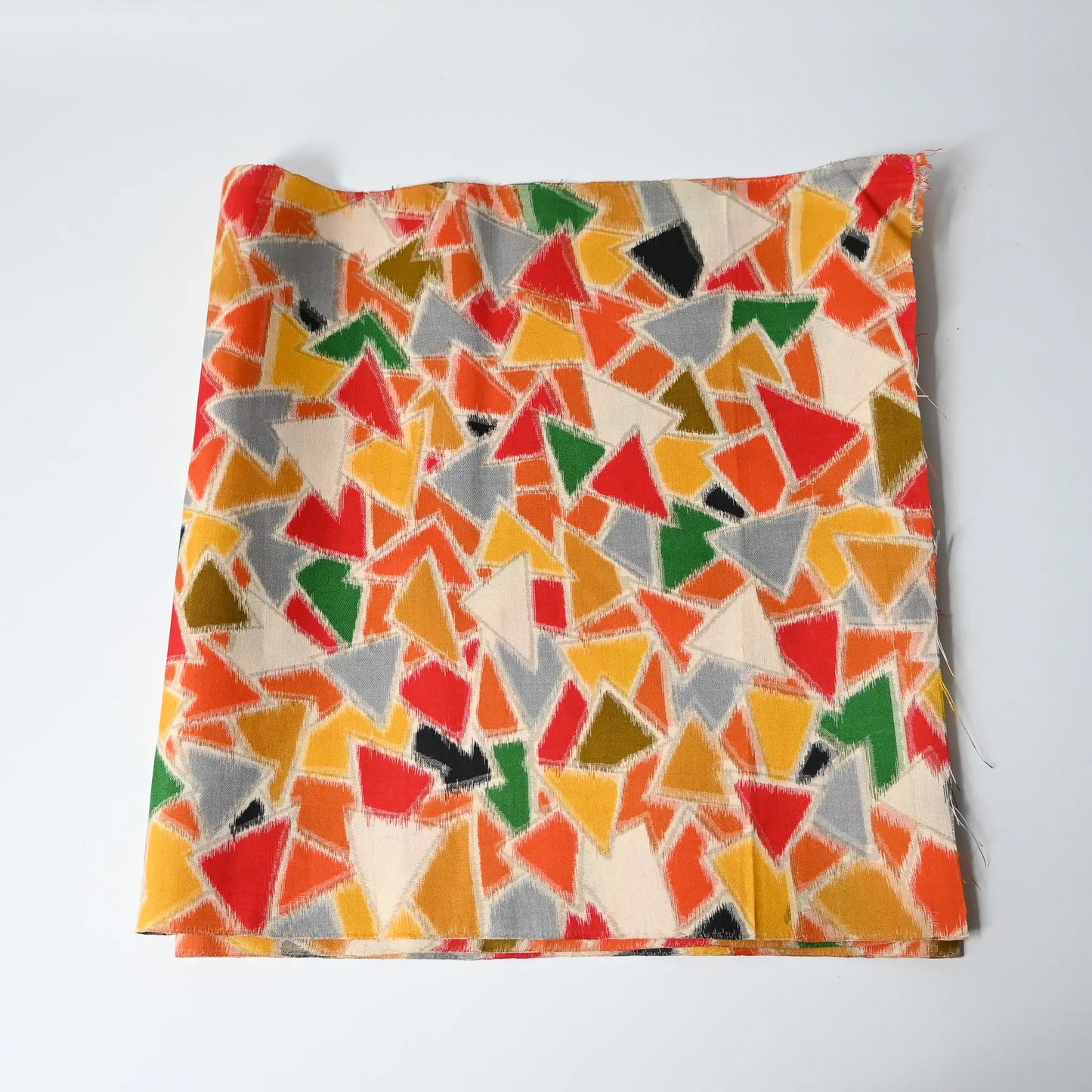 Vintage vibrant geometric Meisen silk kimono fabric piece from mid-20th century.