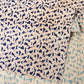 Close-up view of vintage Japanese wasarasa cotton fragment with Tatewaku floral motif.