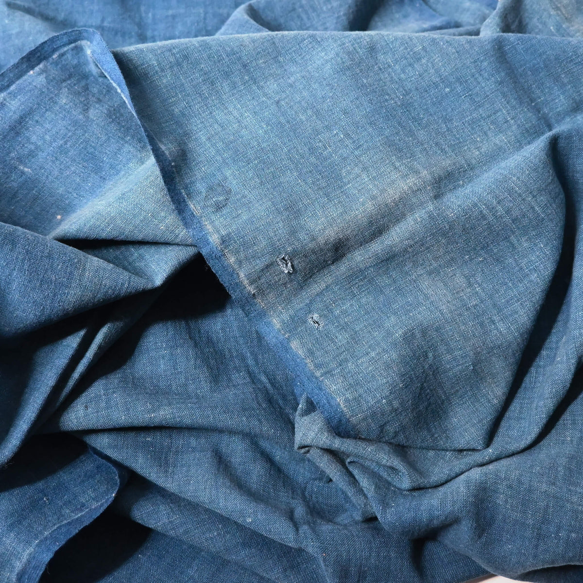 Close-up view of vintage Japanese wide width cotton in light indigo blue, a former futon cover.