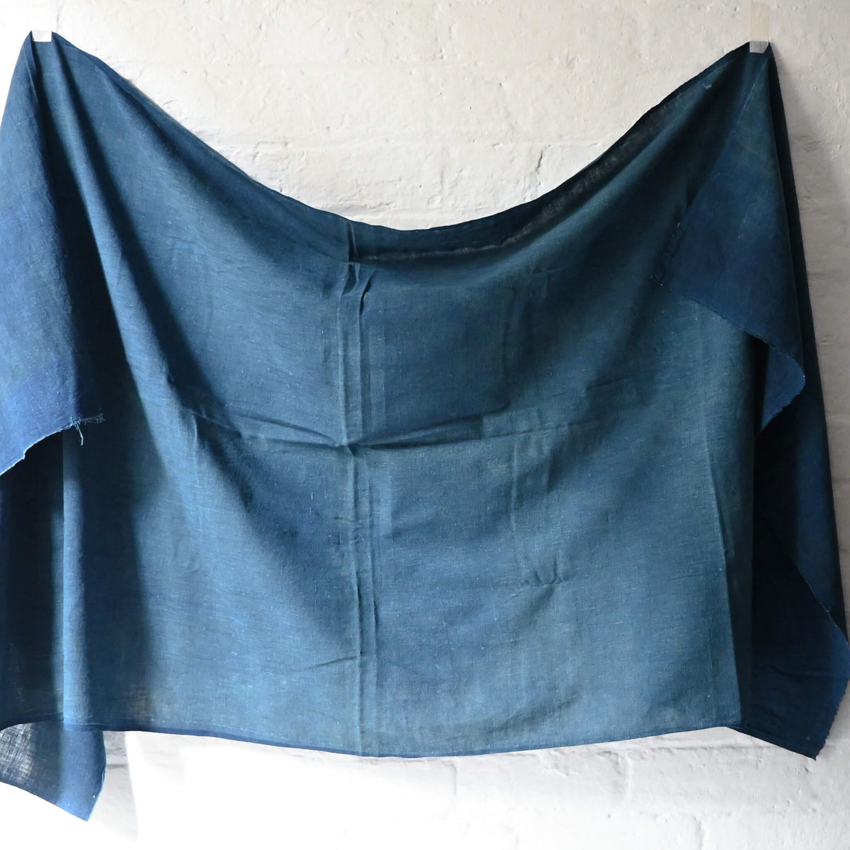 Full view of vintage Japanese wide width cotton in light indigo blue, a former futon cover.
