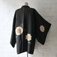Vintage Japanese women's black silk haori with stylised floral motif.