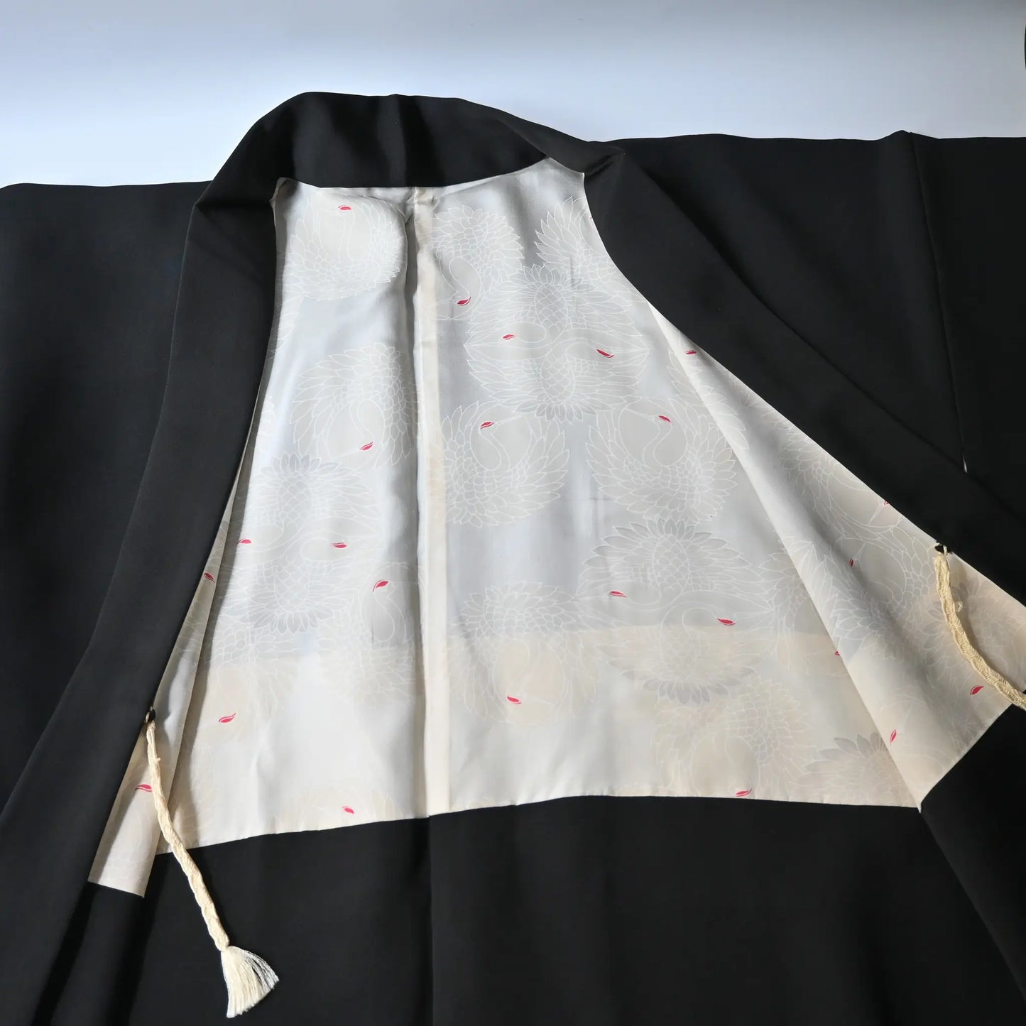 Vintage Japanese women's black silk haori with stylised floral motif.