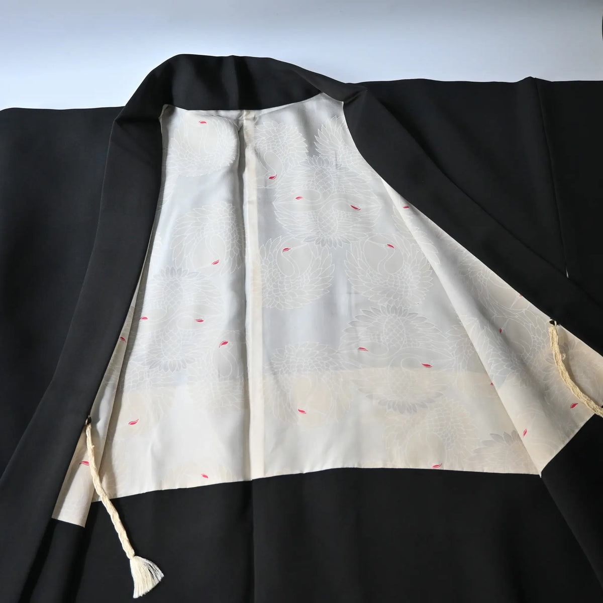 Vintage Japanese women's black silk haori with stylised floral motif.