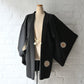 Vintage Japanese women's black silk haori with stylised floral motif.