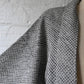 Close-up view of vintage women's black and white silk haori with all-over kanoko shibori pattern.