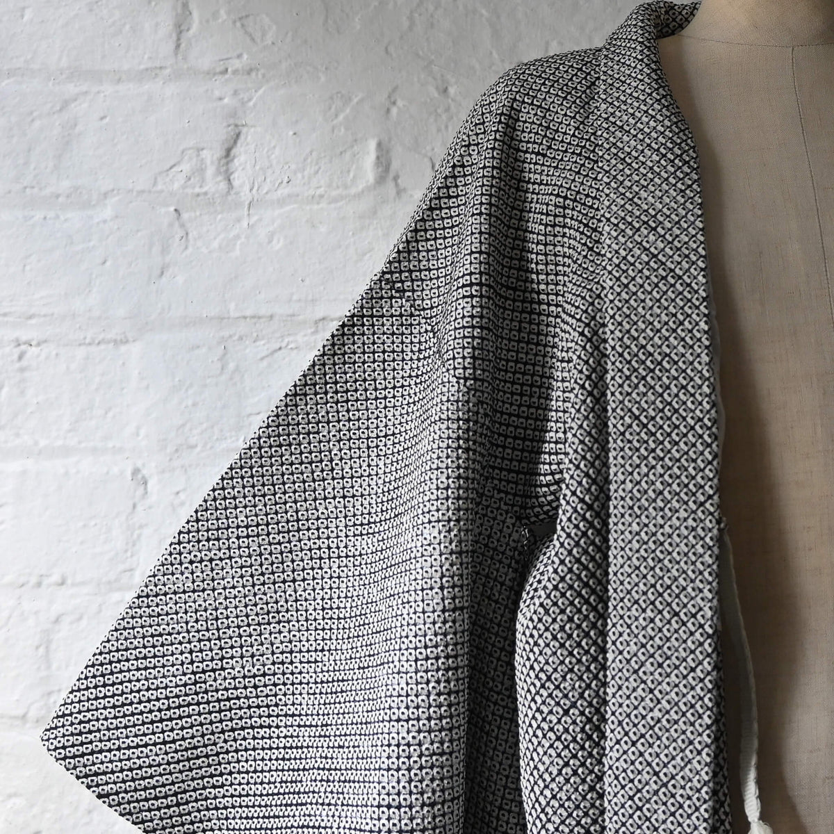 Vintage women's black and white silk haori with all-over kanoko shibori pattern.