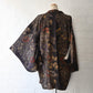 Vintage Japanese women’s haori in dark purple with an all-over chrysanthemum design in gold. Lightweight synthetic fabric.