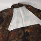 Vintage Japanese women’s haori in dark purple with an all-over chrysanthemum design in gold. Lightweight synthetic fabric.