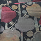 Close-up view of vintage women's silk fukuro obi with stylised plum blossom woven with metallic silver and gold.
