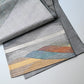 Detailed view of vintage Japanese women's silk metallic Bukuro obi with mountain design.