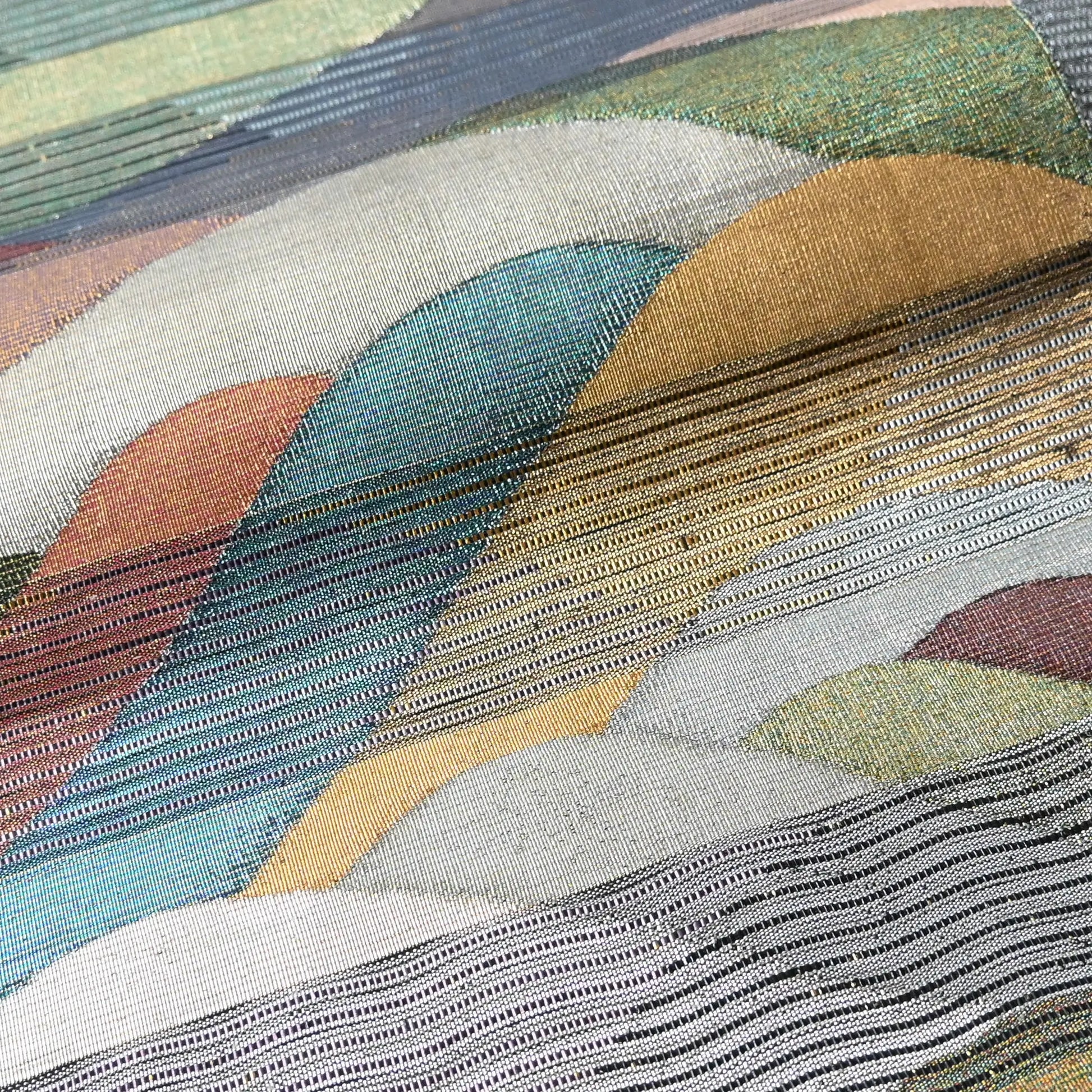 Detailed view of vintage Japanese women's silk metallic Bukuro obi with mountain design.