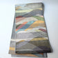 Full view of vintage Japanese women's silk metallic Bukuro obi with mountain design.