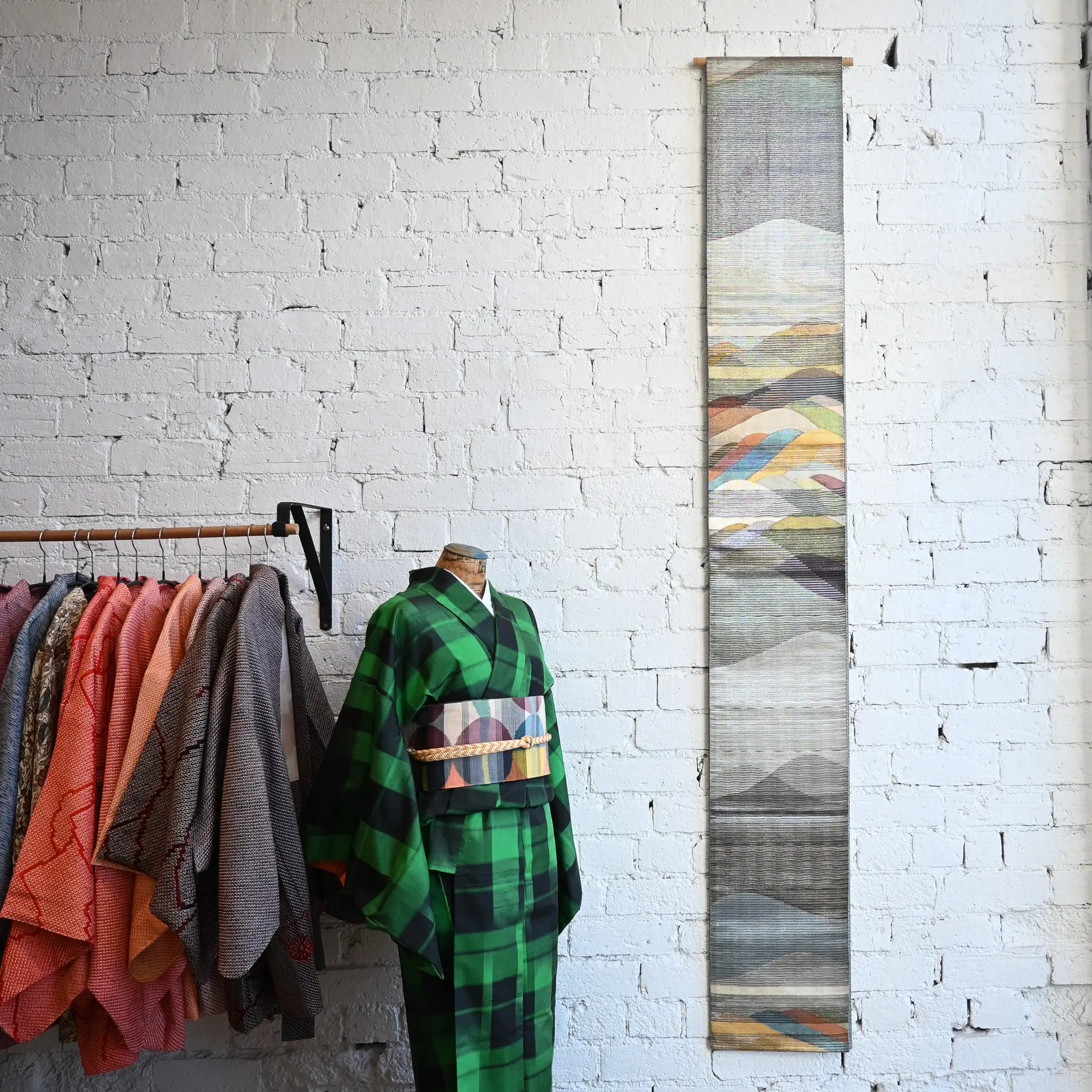 Vintage Japanese women's silk metallic Bukuro obi with mountain design works well as a wall hanging.