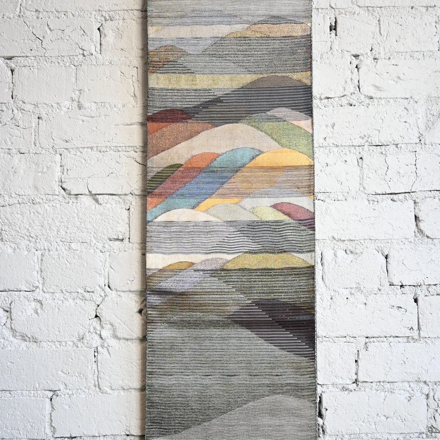 Main patterned section of vintage Japanese women's silk metallic Bukuro obi with mountain design.