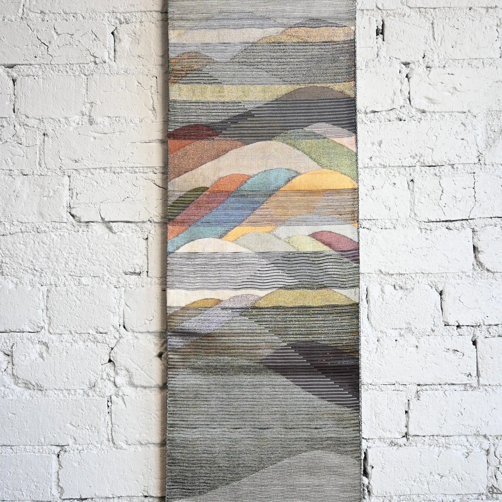 Main patterned section of vintage Japanese women's silk metallic Bukuro obi with mountain design.