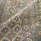 Close-up view of vintage Japanese women's olive green silk crepe haori.