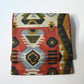 Vintage Japanese women's tsumugi silk Fukuro obi with abstract geometric design in rustic orange and green tone.