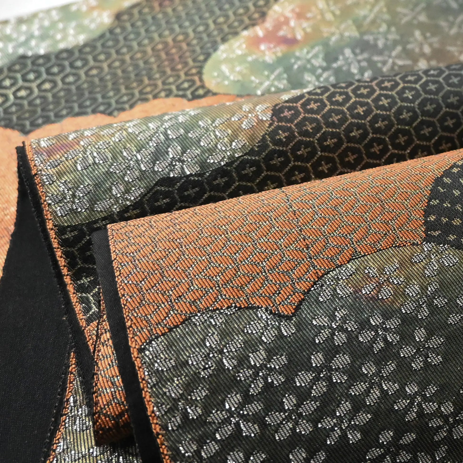 Detailed view of vintage Japanese women's silk fukuro obi in black and silver with cloud motif.