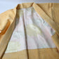 Vintage women's silk shibori haori in pastel yellow tone.