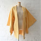 Vintage women's silk shibori haori in pastel yellow tone.