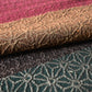 Close-up view of vintage Japanese women's silk textured geometric design Fukuro obi in warm rustic tones.