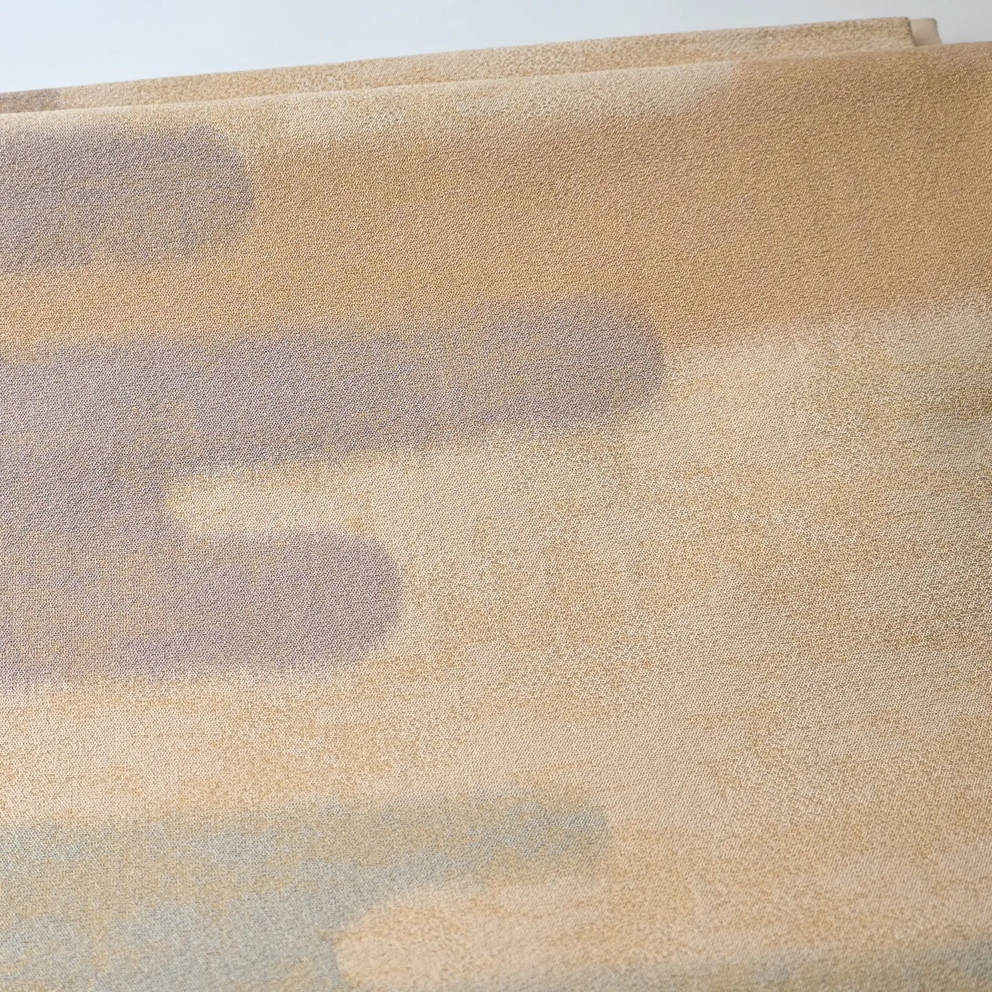 Close-up view of vintage Japanese women's silk Fukuro Obi in soft gold, purple and blue with Kasumi pattern.