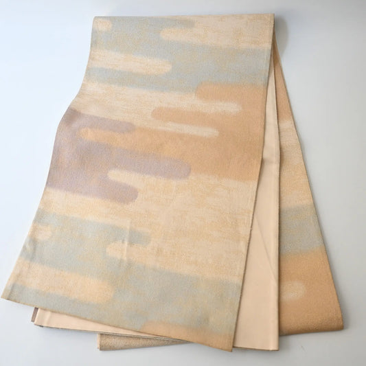 Full view of vintage Japanese women's silk Fukuro Obi in soft gold, purple and blue with Kasumi pattern.
