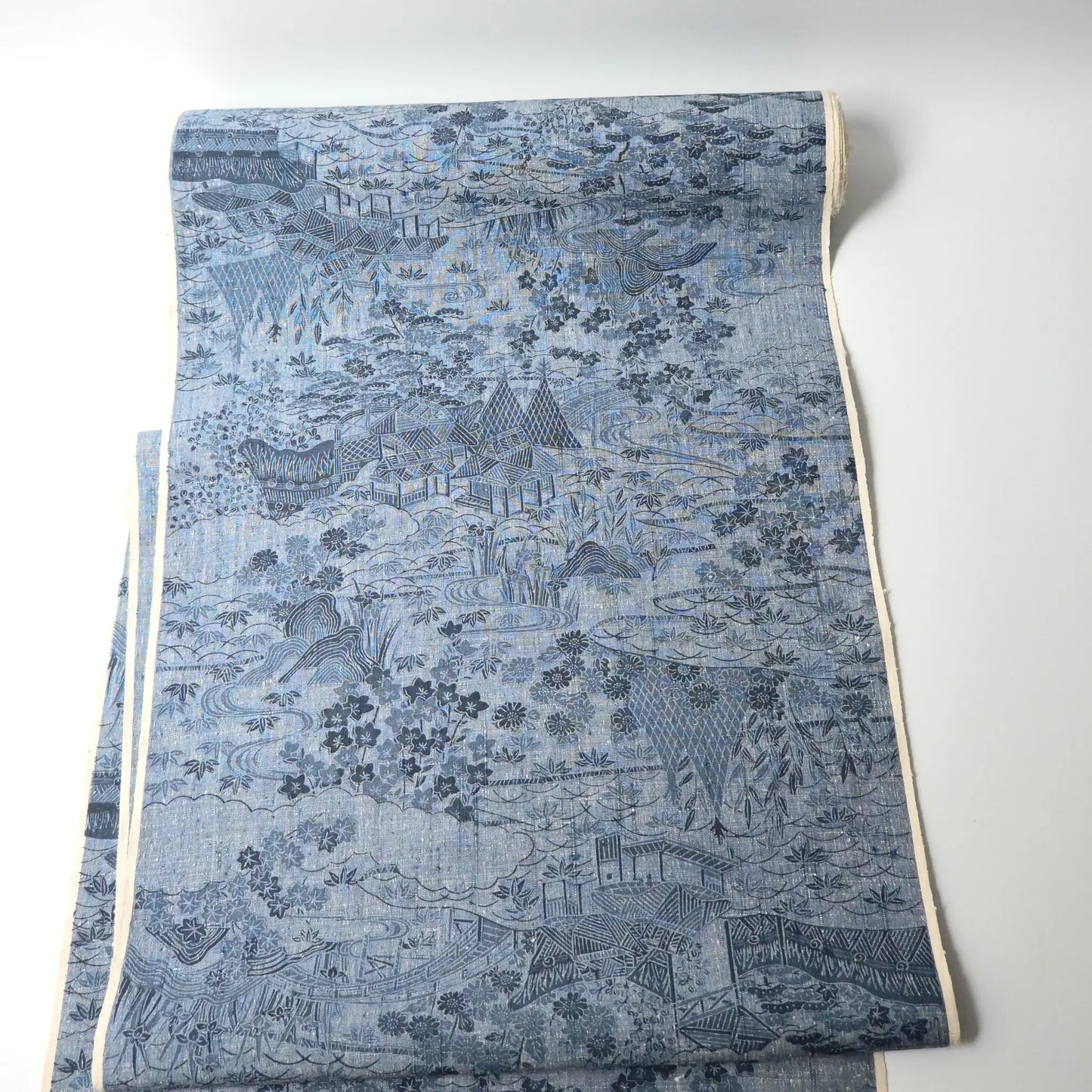 Vintage women's tsumugi silk kimono fabric in soft steel blue.