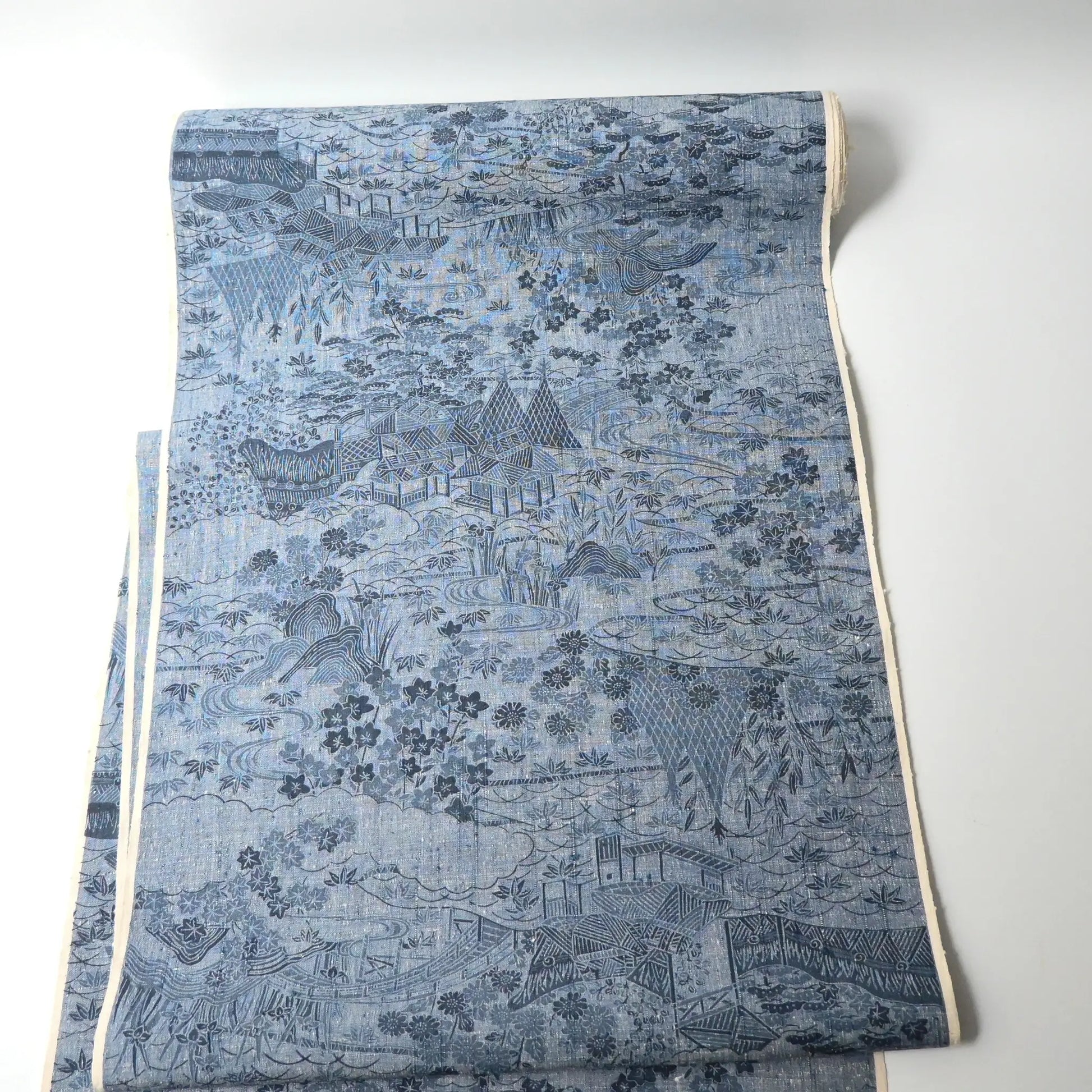 Vintage women's tsumugi silk kimono fabric in soft steel blue.